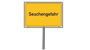 Auf einem gelben Hinweisschild steht das Wort Seuchengefahr